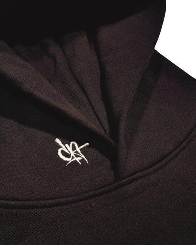 embroidery detail on dark as day hoodies on the collar